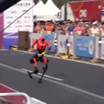 Humanoid robots cut almost two hours off last year's time in the Beijing half marathon