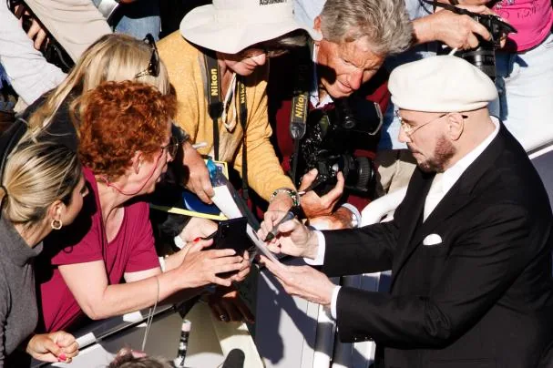 Travolta signed autographs and took selfies with his fans