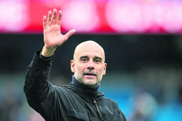 Guardiola salutes the City fans in the match against Brentford