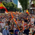 Thousands of people march through downtown Madrid in a protest against Sánchez