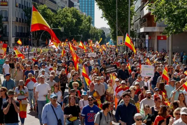 Thousands of people march through downtown Madrid in a protest against Sánchez