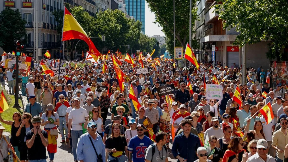 Thousands of people march through downtown Madrid in a protest against Sánchez