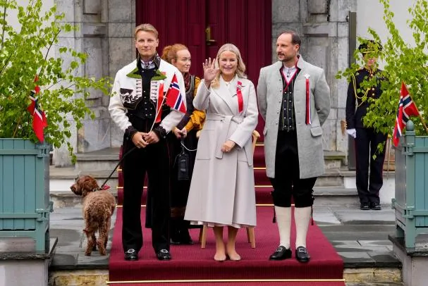 Crown Princess Mette-Marit with a respirator, Crown Prince Haakon and Prince Sverre Magnus greet the children's procession during the Norwegian Constitution Day celebrations in Skaugum, Asker, Norway, on May 17, 2026.