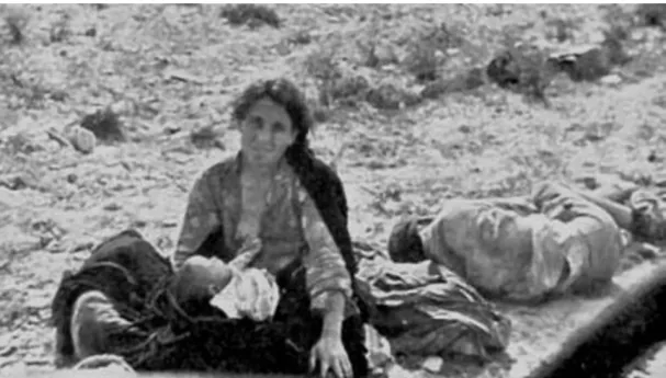 A mother breastfeeds her child during the desbandá 