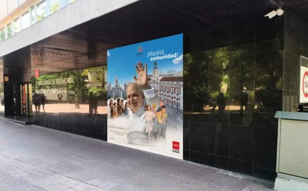 Building of the Community of Madrid with posters of the Pope's visit