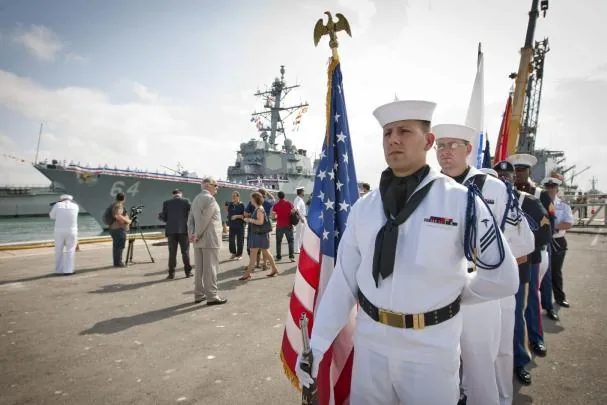 U.S. sailors in front of the USS Carney docked at the Rota base.