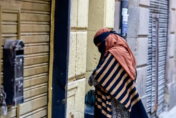 A woman in Barcelona covered with Islamic veil