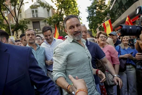 Vox leader Santiago Abascal (c) marched alongside MEP Jorge Buxadé behind a party banner that read 'Removing Sánchez is also a national priority'