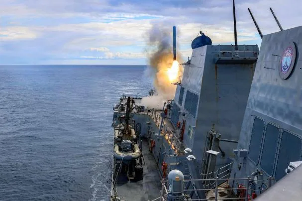 A U.S. destroyer launches a Tomahawk missile against Iranian targets
