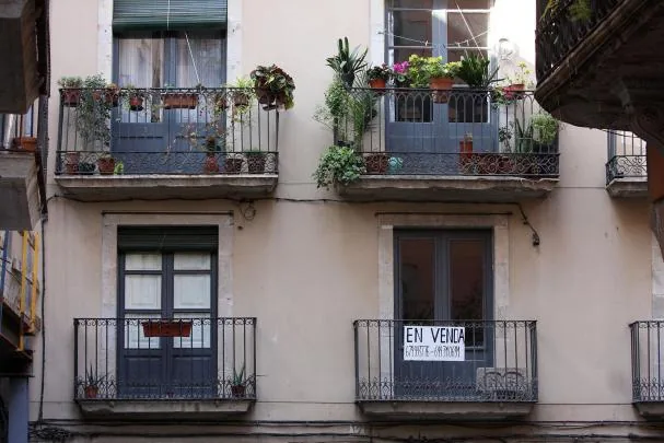 A sign with an apartment for sale 