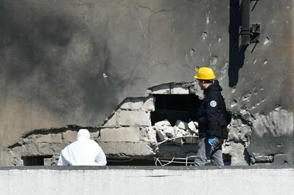 Police and forensic investigators examining the site of the Russian drone impact on a residential building in Galati (Romania), May 29, 2026 