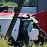 The collision of a train with a school bus in Belgium causes four fatalities