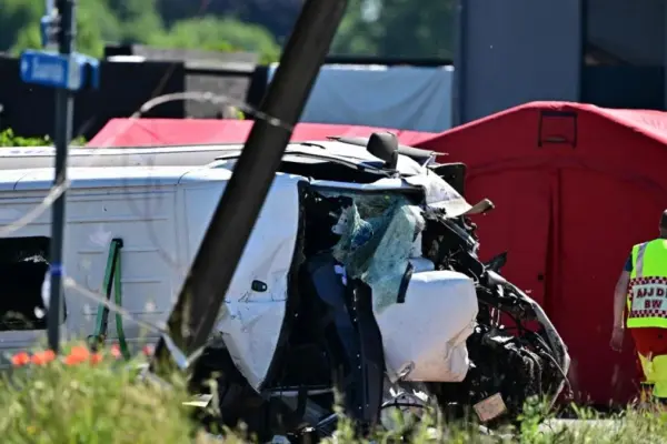 The collision of a train with a school bus in Belgium causes four fatalities