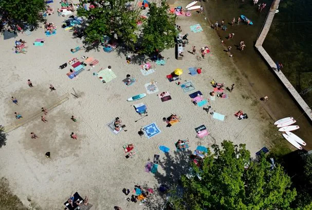 In Germany they are also looking for a remedy to the unexpected heat. This drone image shows people cooling off yesterday at Lake Bleibtreussee, in Brühl.