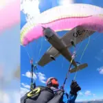 A paraglider saves her life after being run over by a plane mid-jump