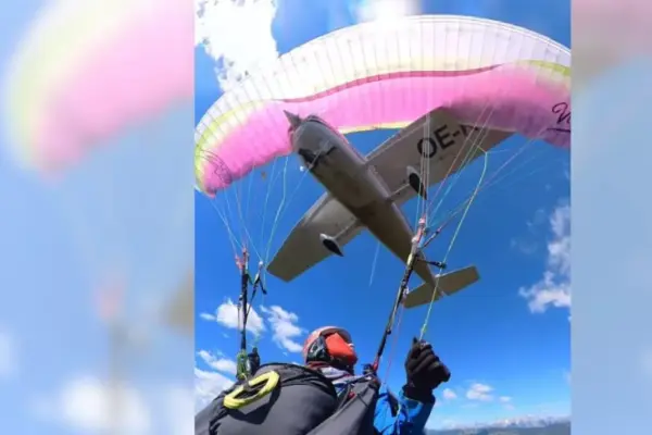 A paraglider saves her life after being run over by a plane mid-jump
