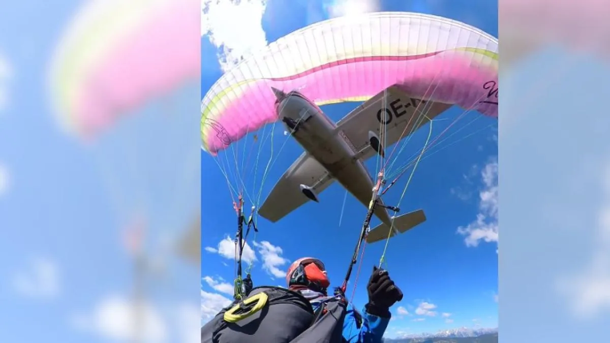A paraglider saves her life after being run over by a plane mid-jump