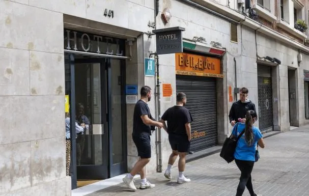 Several people leave the building in question