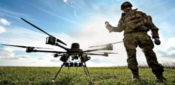 An autonomous drone next to a soldier