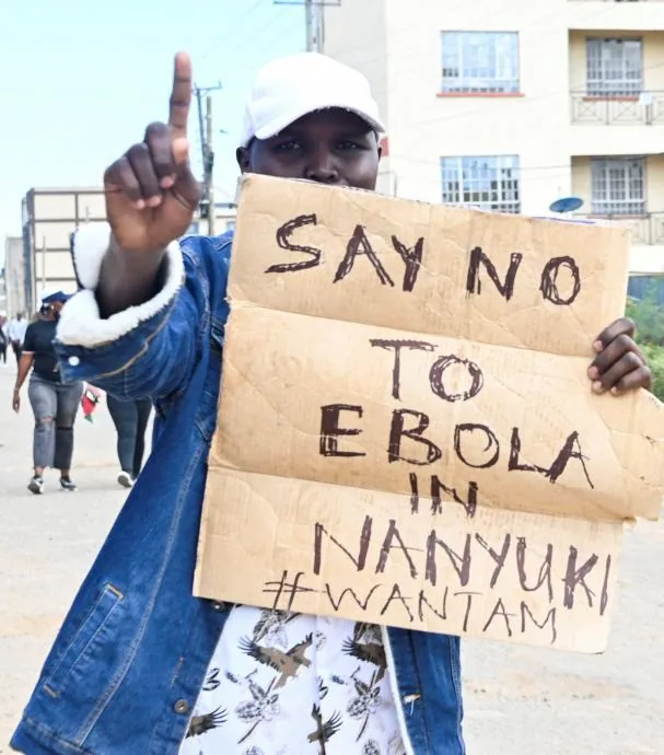 A protester holding a sign against the Ebola center in Nanyuki, 200 kilometers north of the capital, Nairobi 