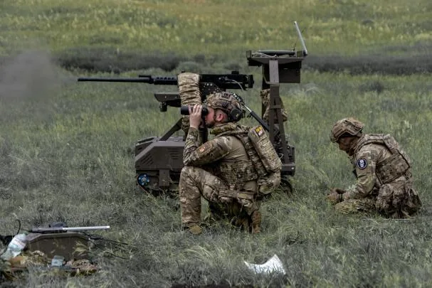 Ukrainian soldiers conducting maneuvers with a ground drone in the Kharkiv region on May 24
