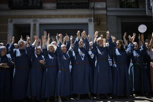 A group of nuns greet Pope Leo XIV on his tour through the center of Madrid in the popemobile