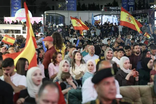 Palestinians cheer the team in Ramallah during the final 