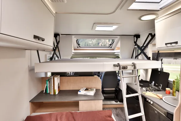 The drop-down roof bed allows enjoying another bed 