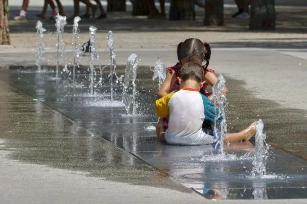 Some children cool off in a fountain in Logroño, this summer