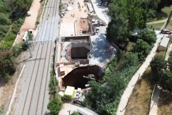 A sinkhole engulfs a crane at the undergrounding works in Montcada i Reixac