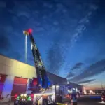 Firefighting crews intervene in the fire at an industrial warehouse in Ajalvir