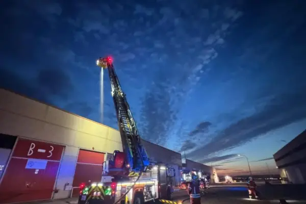 Firefighting crews intervene in the fire at an industrial warehouse in Ajalvir