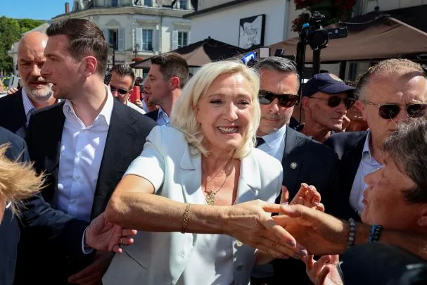 Marine Le Pen salutes her followers, after announcing her candidacy for 2027
