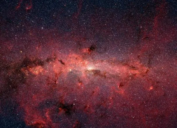 A photograph from the Spitzer telescope reveals molecular clouds at the center of the galaxy, including the area where erythritol was found
