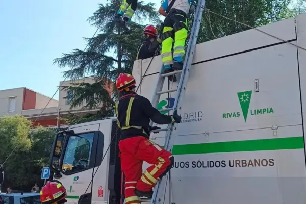 A woman who was sleeping in a paper container is rescued from the recycling truck after hearing her screams