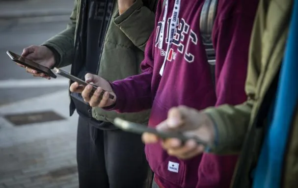 Having a smartphone, the more expensive the better, is a status symbol for young people