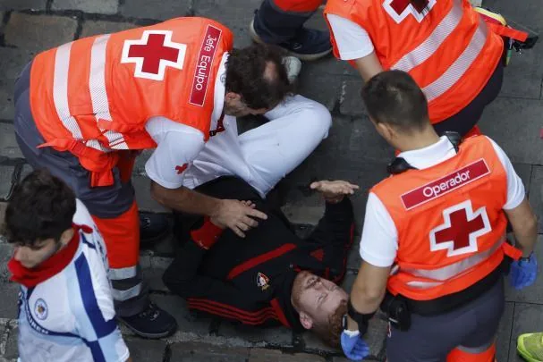 A runner is attended to by medical services 
