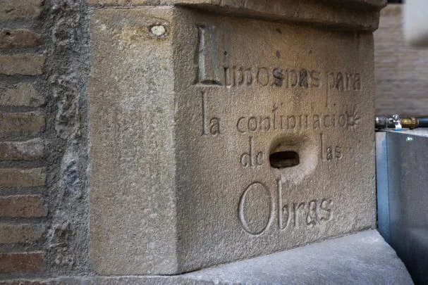 The stone with the slot to deposit donations