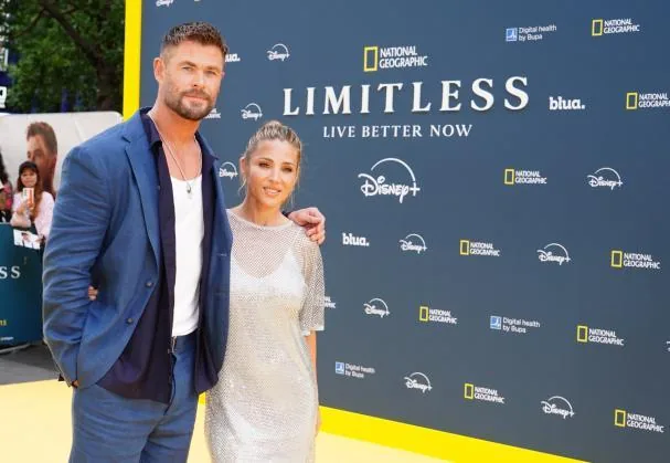 With her husband, Australian actor Chris Hemsworth.