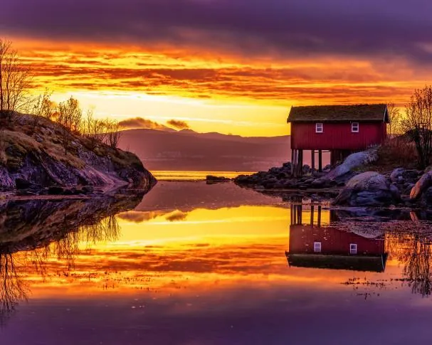 The midnight sun in the Saltstraumen fjord, Norway