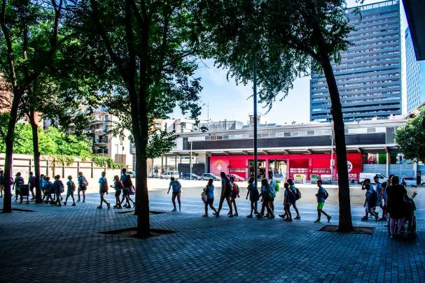 Children from a summer camp walking through Poblenou, Barcelona. 