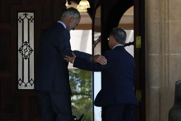 The King, accompanied by the president of Ceuta, Juan Jesús Vivas, entering the Marivent Palace 