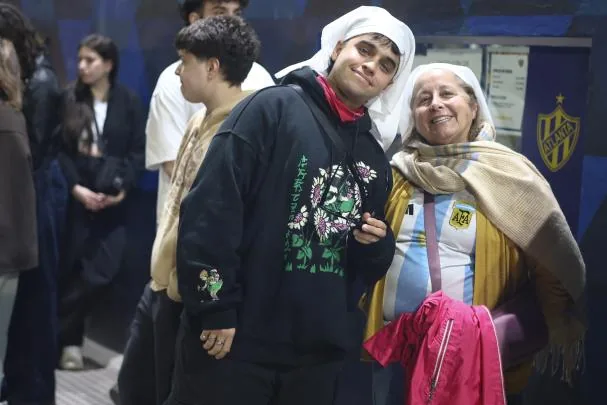 Rosalía fans pose before the artist's concert outside the Movistar Arena in Buenos Aires (Argentina)