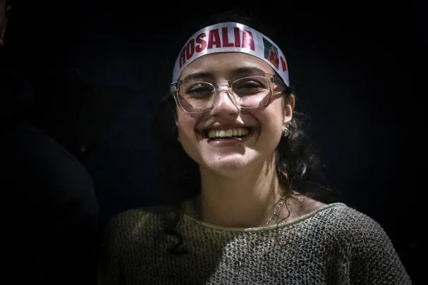 A fan of singer Rosalía poses before the artist's concert this Saturday, outside the Movistar Arena in Buenos Aires