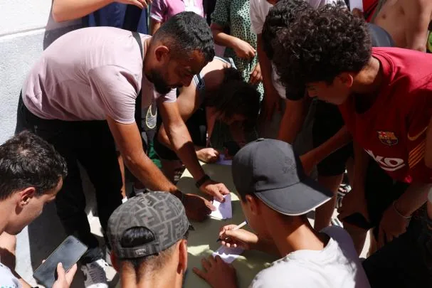 Ramza Moreno, while registering the data of some of the migrants who have arrived in Ceuta