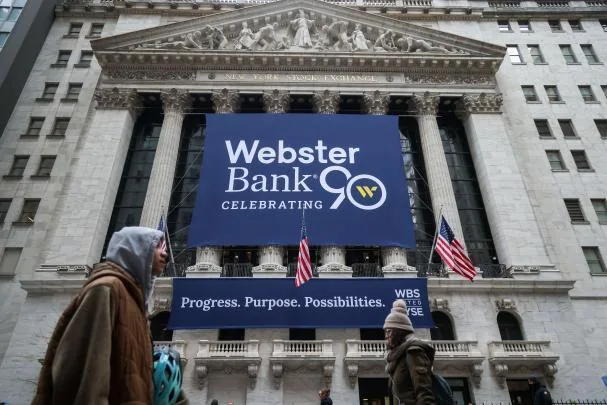 A Webster Bank sign on the New York Stock Exchange  