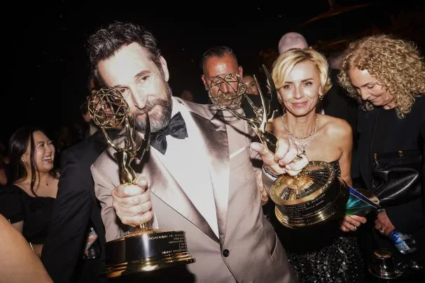 Actor Noah Wyle holds his Emmy awards during the Governors Gala, held after the 78th Primetime Emmy Awards