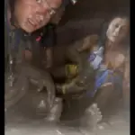 A woman buried by mud and a man trapped in a tunnel rescued alive eleven days after the flood in Nepal