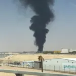 Flames and black smoke are seen near Riyadh airport