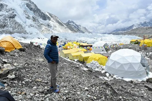 At the base. In this photograph taken on May 2, 2021, Nepali climber Kami Rita Sherpa poses for a photo for AFP at the Everest base camp
